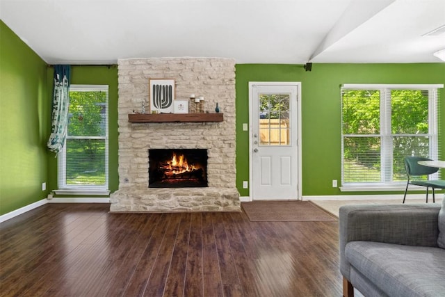 1405 Meadowmear Dr, Austin, TX 78753 - living room with hardwood / wood-style flooring, plenty of natural light, and a stone fireplace