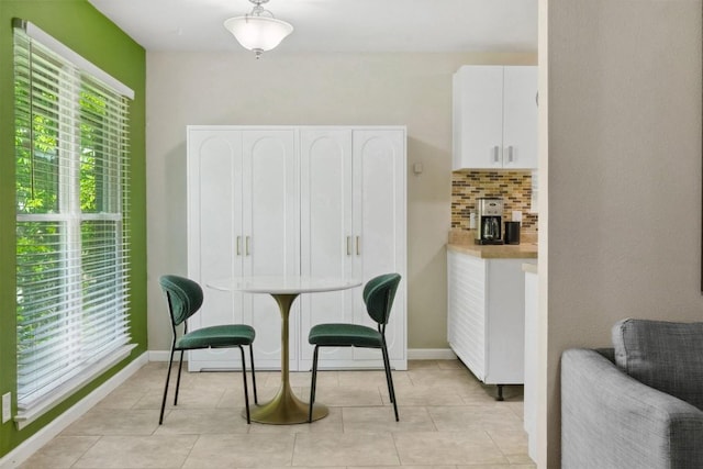 1405 Meadowmear Dr, Austin, TX 78753 - dining area with baseboards and light tile patterned floors