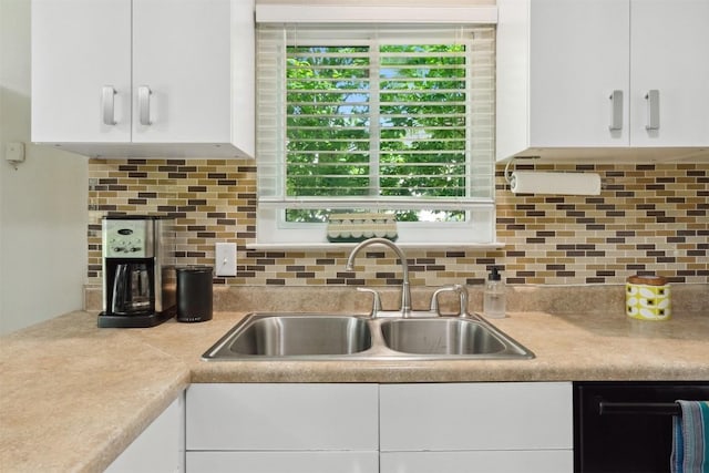 1405 Meadowmear Dr, Austin, TX 78753 - kitchen with white cabinetry, a sink, light countertops, and backsplash