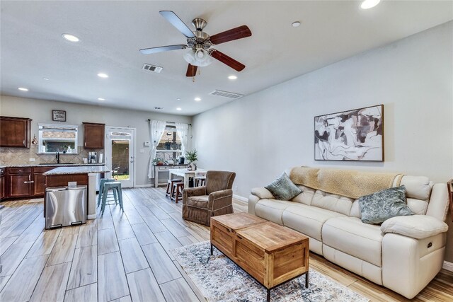 1012 Lost Pines Ln, Cedar Park, TX 78613 - living area with ceiling fan, plenty of natural light, baseboards, recessed lighting, and light wood finished floors