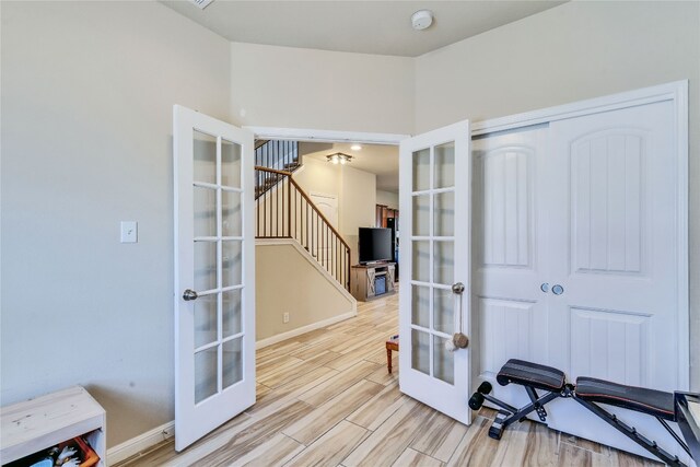 1012 Lost Pines Ln, Cedar Park, TX 78613 - exercise room featuring french doors, light wood-style floors, and baseboards