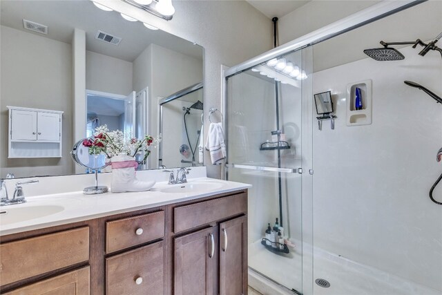 1012 Lost Pines Ln, Cedar Park, TX 78613 - bathroom with a stall shower and double vanity