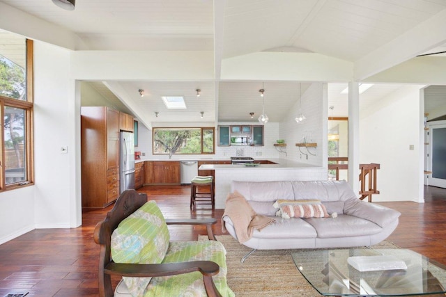 7106 Mountain Trl, Austin, TX 78732 - living room featuring lofted ceiling, dark wood-type flooring, and a skylight