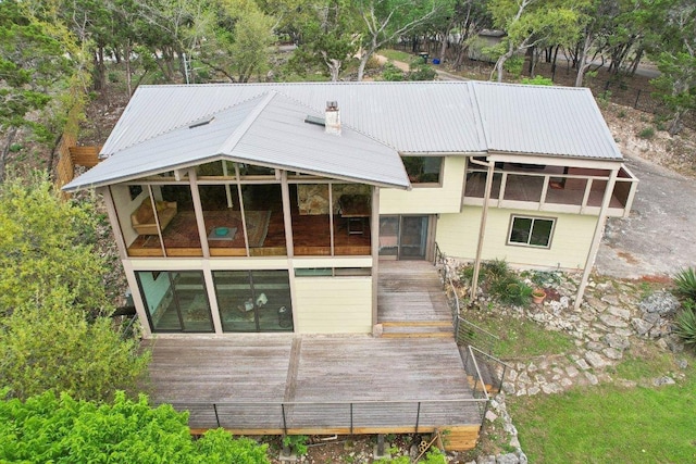7106 Mountain Trl, Austin, TX 78732 - rear view of property featuring a metal roof and a wooden deck
