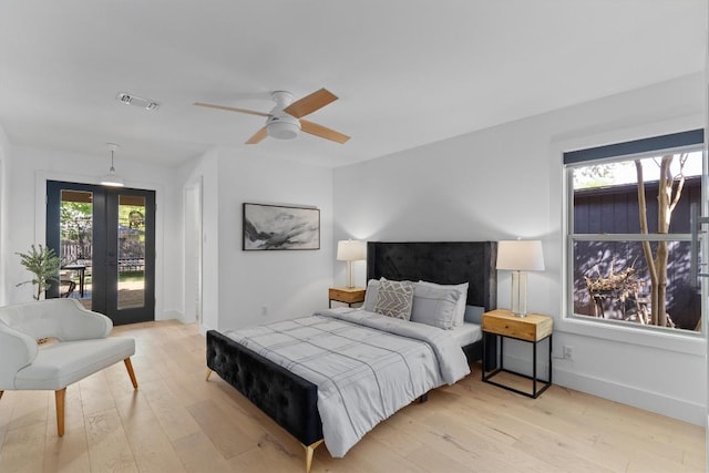 3306 Whiteway Dr, Austin, TX 78757 - bedroom with light wood-style floors, visible vents, access to exterior, and french doors