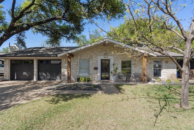 3306 Whiteway Dr, Austin, TX 78757 - ranch-style house featuring a garage, stone siding, a front yard, and concrete driveway
