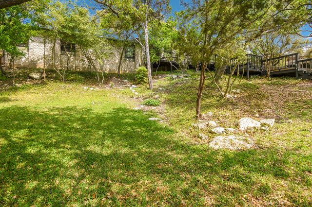 6304 Whitemarsh Valley Walk, Austin, TX 78746 - view of yard featuring a wooden deck
