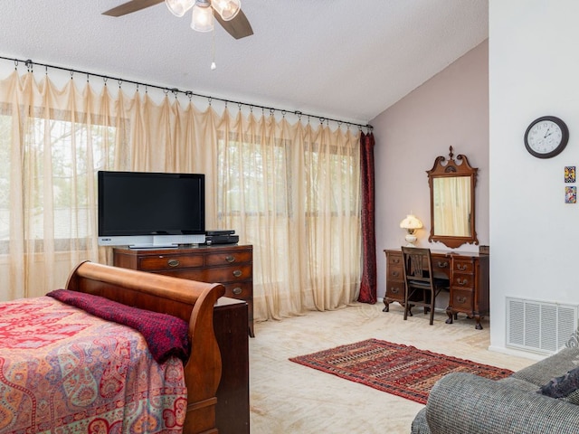 bedroom with ceiling fan, carpet, a textured ceiling, visible vents, and lofted ceiling