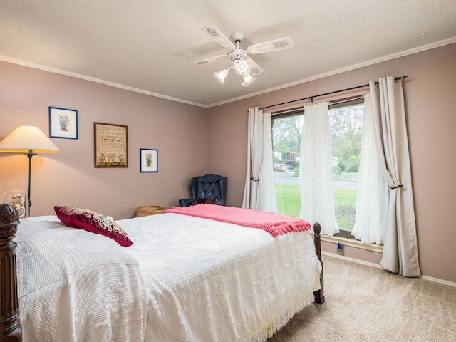 carpeted bedroom featuring crown molding, baseboards, ceiling fan, and a textured ceiling