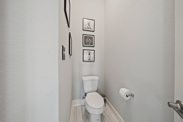 132 Alba Ave, San Marcos, TX 78666 - bathroom with baseboards, tile patterned flooring, and toilet