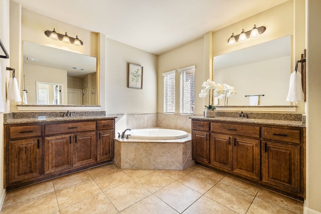 1812 Buffalo Thunder, Leander, TX 78641 - bathroom featuring tile patterned flooring, a garden tub, and two vanities