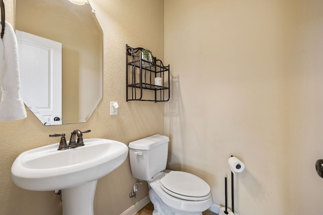 1812 Buffalo Thunder, Leander, TX 78641 - half bathroom with toilet and a sink