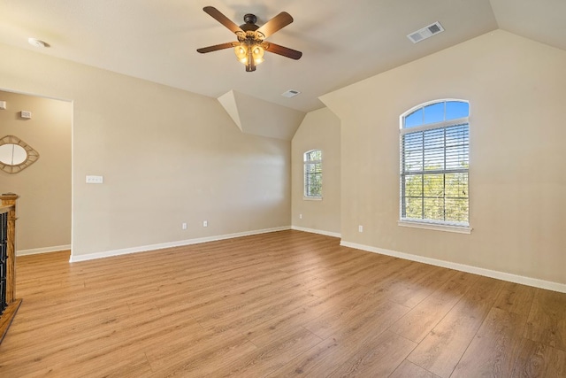 1812 Buffalo Thunder, Leander, TX 78641 - unfurnished living room featuring vaulted ceiling, light wood-style flooring, ceiling fan, and baseboards