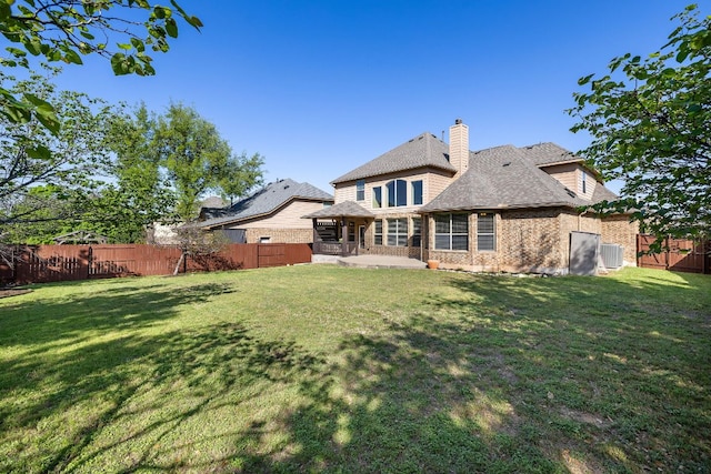 1812 Buffalo Thunder, Leander, TX 78641 - rear view of house with a patio, brick siding, central AC unit, a gazebo, and a chimney