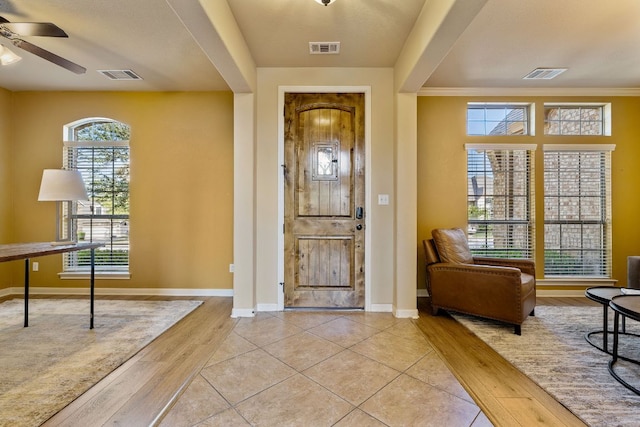 1812 Buffalo Thunder, Leander, TX 78641 - foyer entrance featuring a ceiling fan, wood finished floors, and baseboards