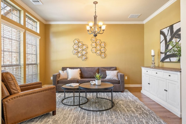 1812 Buffalo Thunder, Leander, TX 78641 - living room featuring a chandelier, ornamental molding, wood finished floors, and baseboards