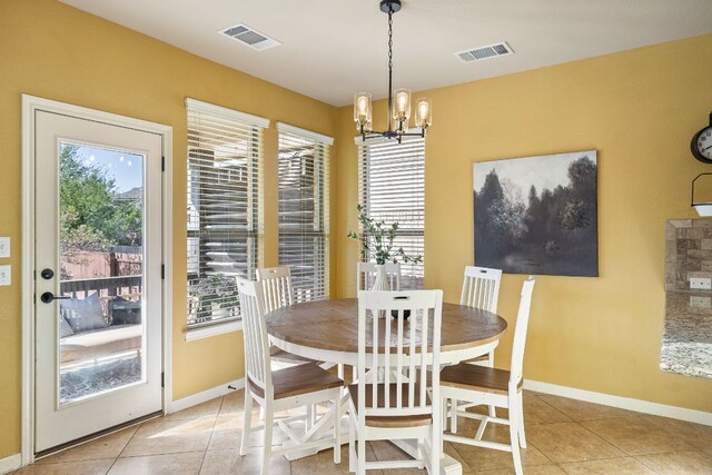 1812 Buffalo Thunder, Leander, TX 78641 - dining room with a chandelier, light tile patterned floors, and baseboards