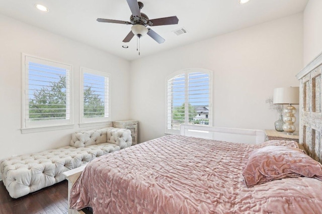 bedroom with visible vents, wood finished floors, multiple windows, and recessed lighting