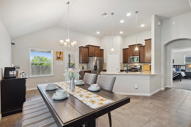 319 Silver Glen Dr, Kyle, TX 78640 - dining room featuring light tile patterned flooring, a chandelier, high vaulted ceiling, and recessed lighting