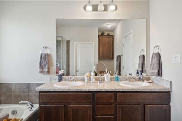 319 Silver Glen Dr, Kyle, TX 78640 - full bathroom featuring double vanity, a shower stall, and a bath