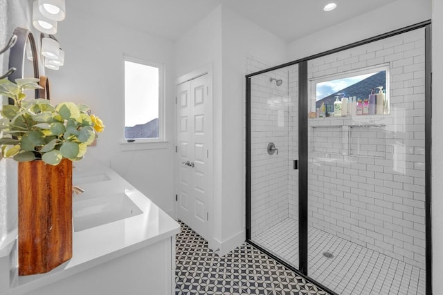 16512 Fetching Ave, Manor, TX 78653 - full bathroom with plenty of natural light, a stall shower, double vanity, baseboards, and recessed lighting