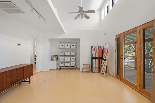 1005 Lisa Dr, Austin, TX 78733 - unfurnished room featuring track lighting, ceiling fan, and a towering ceiling