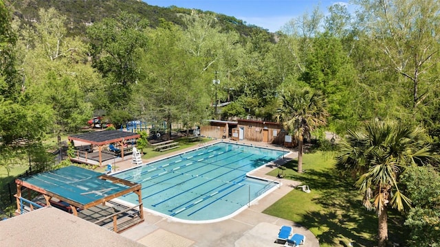 1005 Lisa Dr, Austin, TX 78733 - community pool featuring a view of trees, a patio area, and a gazebo