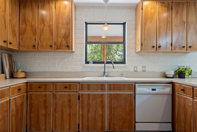 1005 Lisa Dr, Austin, TX 78733 - kitchen featuring dishwasher, decorative backsplash, light countertops, and brown cabinetry