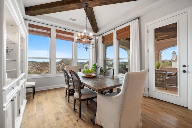 16319 Golden Top Dr, Austin, TX 78738 - dining space featuring a chandelier, light wood finished floors, plenty of natural light, and beamed ceiling