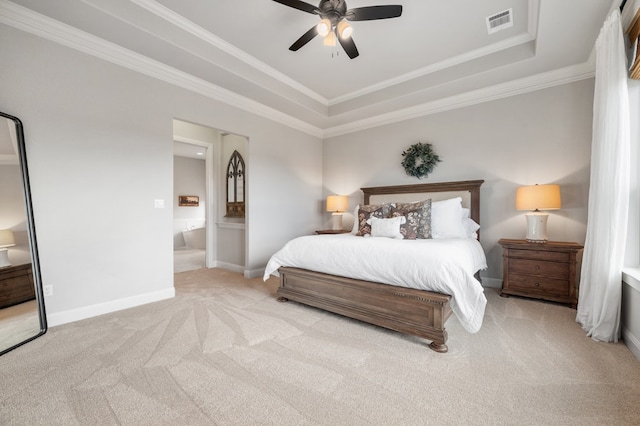 16319 Golden Top Dr, Austin, TX 78738 - carpeted bedroom with a tray ceiling, ornamental molding, baseboards, ensuite bathroom, and a ceiling fan
