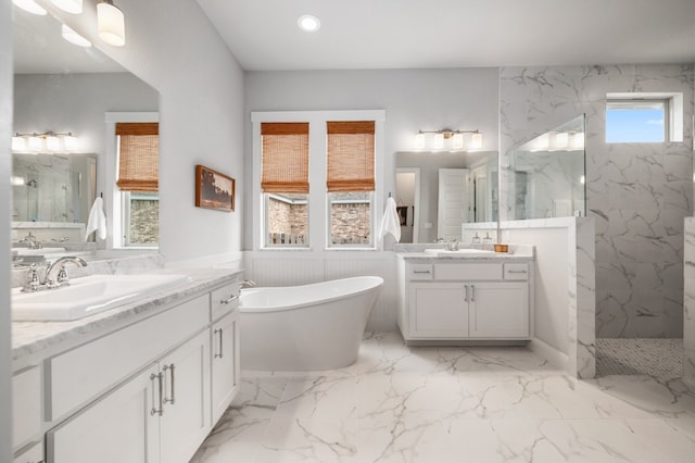 16319 Golden Top Dr, Austin, TX 78738 - bathroom featuring a marble finish shower, marble finish floors, a soaking tub, two vanities, and recessed lighting