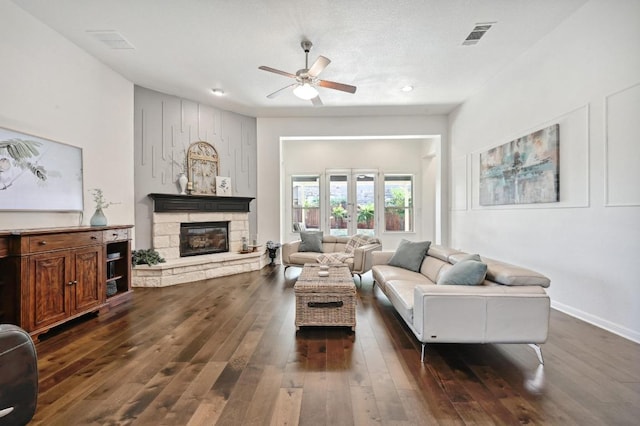 650 Ledge Stone Dr, Austin, TX 78737 - living room with a ceiling fan, dark wood-style floors, a fireplace, recessed lighting, and baseboards