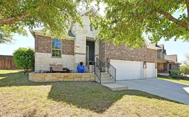 650 Ledge Stone Dr, Austin, TX 78737 - view of front of home featuring stone siding, concrete driveway, a garage, and brick siding