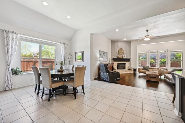 650 Ledge Stone Dr, Austin, TX 78737 - dining room featuring a stone fireplace, vaulted ceiling, recessed lighting, baseboards, and ceiling fan