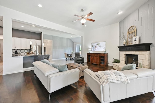 650 Ledge Stone Dr, Austin, TX 78737 - living area with a ceiling fan, dark wood-style flooring, recessed lighting, and a fireplace