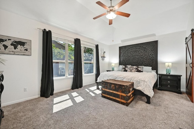 650 Ledge Stone Dr, Austin, TX 78737 - carpeted bedroom with a barn door, vaulted ceiling, baseboards, and a ceiling fan