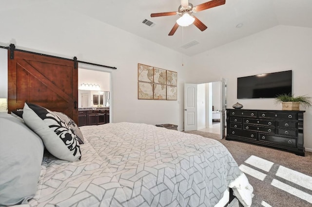650 Ledge Stone Dr, Austin, TX 78737 - bedroom featuring carpet flooring, a barn door, vaulted ceiling, a ceiling fan, and ensuite bath