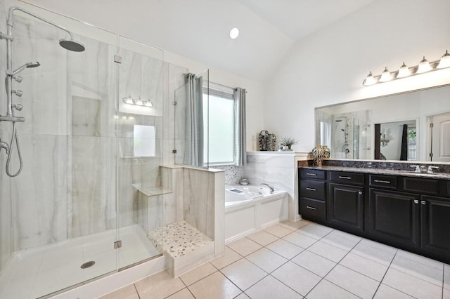 650 Ledge Stone Dr, Austin, TX 78737 - bathroom with vaulted ceiling, vanity, a bath, a stall shower, and tile patterned floors