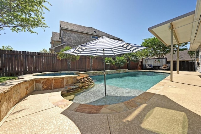 650 Ledge Stone Dr, Austin, TX 78737 - view of swimming pool with a fenced backyard, a pool with connected hot tub, and a patio