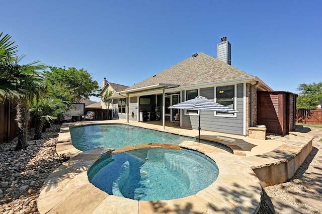 650 Ledge Stone Dr, Austin, TX 78737 - view of pool featuring a fenced backyard, a pool with connected hot tub, and a patio area