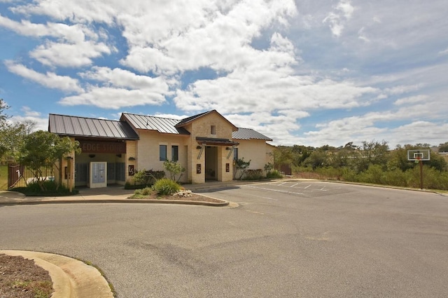 650 Ledge Stone Dr, Austin, TX 78737 - view of front of home with a standing seam roof, uncovered parking, and metal roof