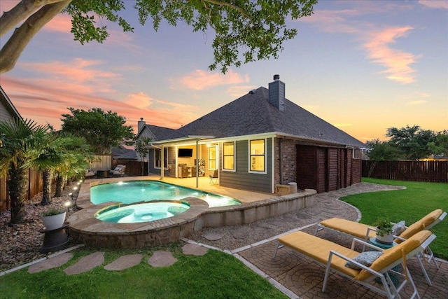 650 Ledge Stone Dr, Austin, TX 78737 - pool at dusk with a patio area and a pool with connected hot tub