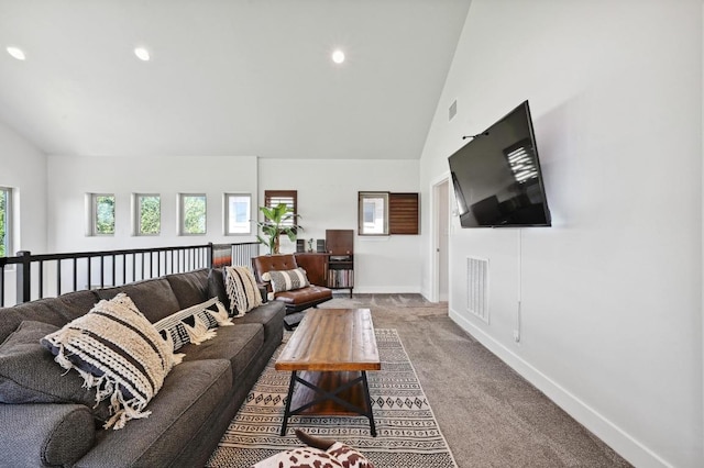 carpeted living room featuring lofted ceiling, baseboards, and recessed lighting