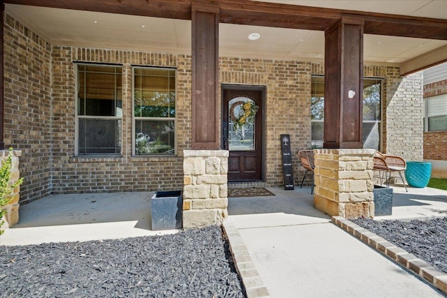 12907 Gordons Hvn, San Antonio, TX 78253 - doorway to property featuring a porch and brick siding