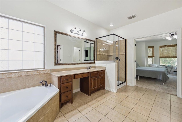 12907 Gordons Hvn, San Antonio, TX 78253 - ensuite bathroom with tile patterned floors, a bath, vanity, a shower stall, and ceiling fan