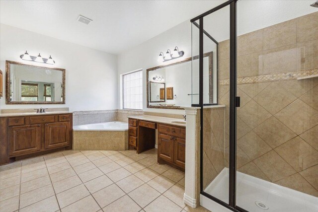 12907 Gordons Hvn, San Antonio, TX 78253 - full bath featuring a garden tub, a stall shower, two vanities, and tile patterned floors