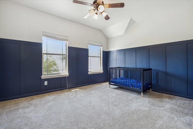 12907 Gordons Hvn, San Antonio, TX 78253 - unfurnished bedroom featuring a decorative wall, carpet, lofted ceiling, wainscoting, and ceiling fan