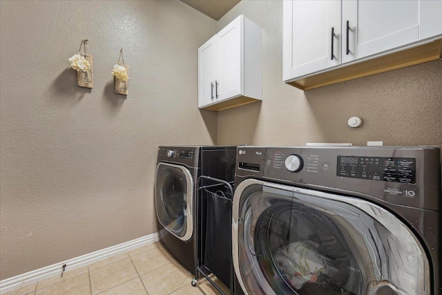 12907 Gordons Hvn, San Antonio, TX 78253 - laundry area featuring cabinet space, separate washer and dryer, and light tile patterned floors