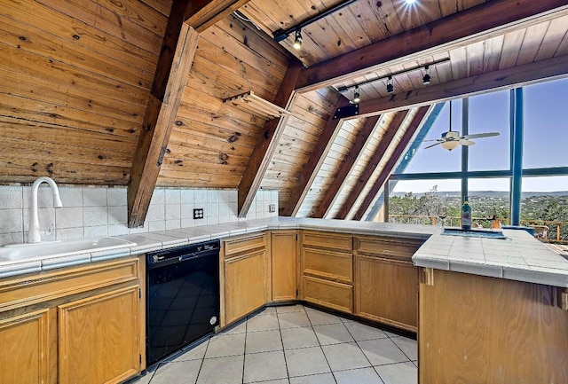 kitchen featuring light tile patterned floors, black dishwasher, wooden ceiling, a sink, and tile counters