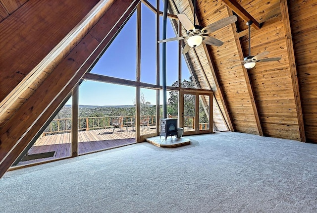 unfurnished sunroom with a wood stove